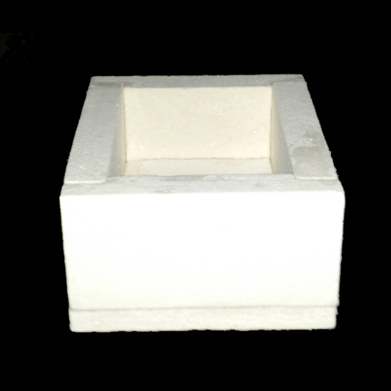 A white, square-shaped high-temperature insulation box with thick walls is shown against a black background. The open-top design suggests it is used for thermal containment or protective applications.