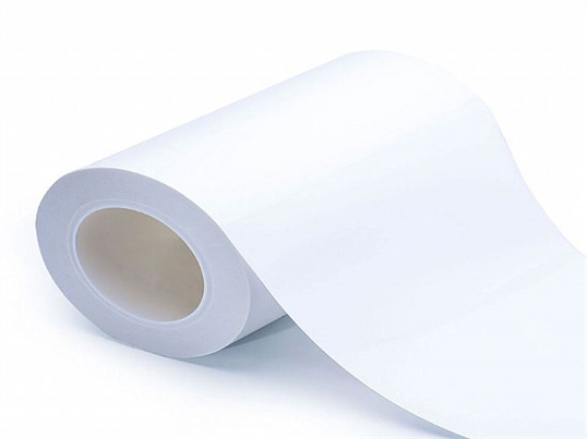 A roll of white thermal insulation tape is partially unrolled on a plain white background. The tape appears to be made of a heat-resistant material, suitable for industrial or protective applications.